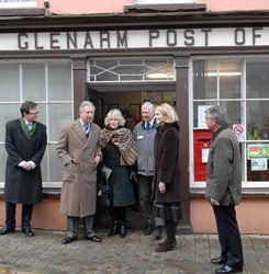 Postmaster William Pullins greets Prince Charles and the Duchess of Cornwall at Glenarm Post Office. Photo: Paul Faith, PA.